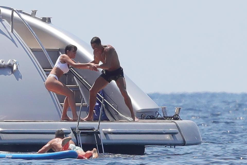Cristiano Ronaldo play-fights with girlfriend Georgina Rodriguez on a yacht in Ibiza